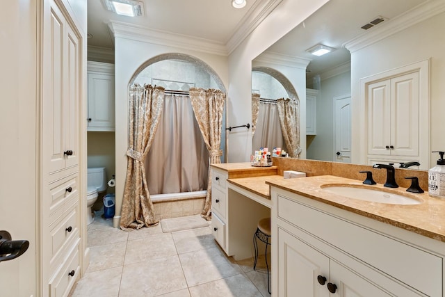 bathroom with vanity, tile patterned flooring, crown molding, and toilet