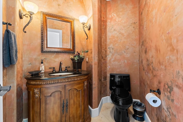 bathroom featuring vanity, toilet, and tile patterned flooring