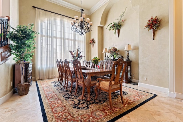 dining area featuring crown molding and a chandelier