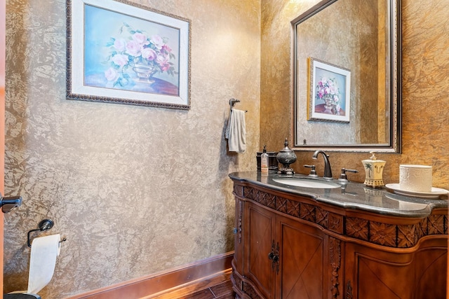 bathroom with vanity and hardwood / wood-style floors