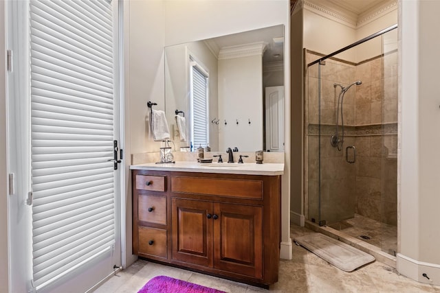 bathroom with a shower with door, ornamental molding, and vanity