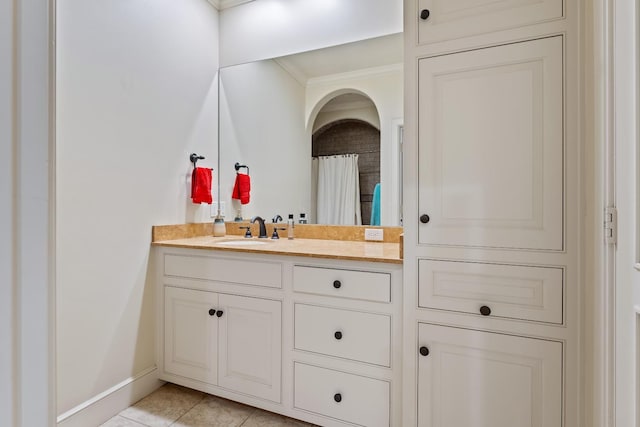 bathroom featuring vanity, curtained shower, tile patterned floors, and crown molding