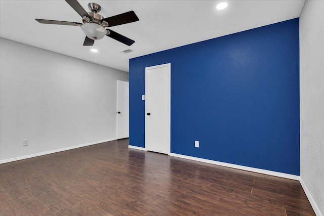 spare room featuring wood finished floors, ceiling fan, recessed lighting, and baseboards
