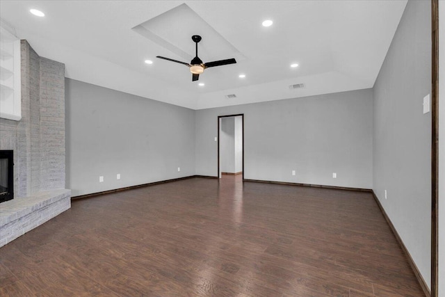 unfurnished living room with recessed lighting, a fireplace, ceiling fan, baseboards, and wood finished floors