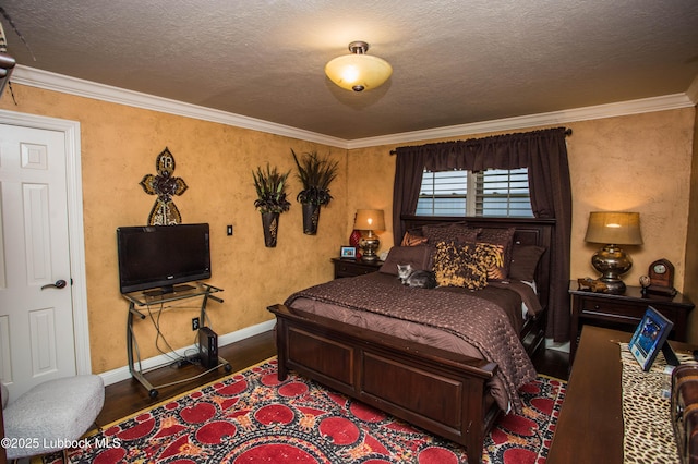 610 N 20th St, Lamesa, TX 79331 - bedroom with wood finished floors, crown molding, and a textured ceiling