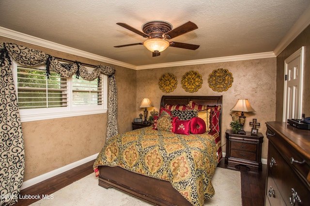610 N 20th St, Lamesa, TX 79331 - bedroom with wood finished floors, ornamental molding, a ceiling fan, and a textured ceiling