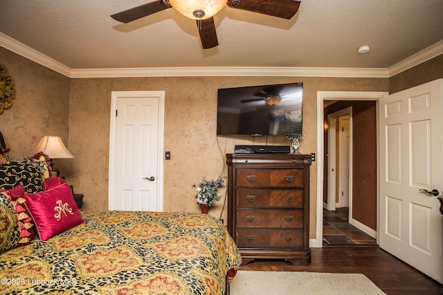 610 N 20th St, Lamesa, TX 79331 - bedroom with hardwood / wood-style flooring, crown molding, and ceiling fan