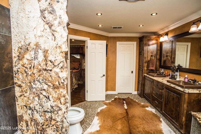 610 N 20th St, Lamesa, TX 79331 - full bathroom featuring double vanity, ornamental molding, and recessed lighting