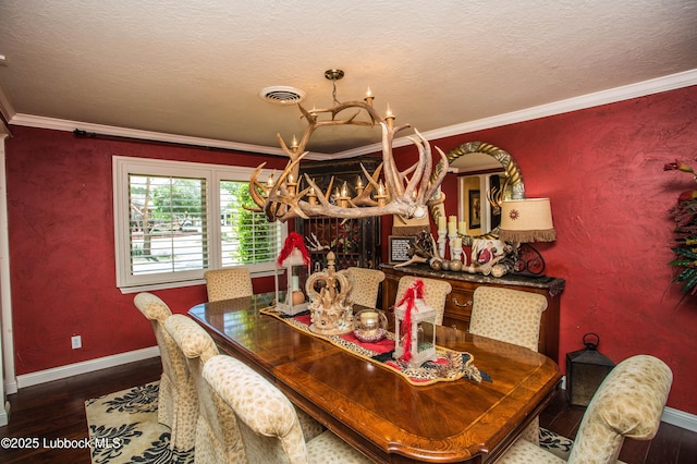 610 N 20th St, Lamesa, TX 79331 - dining room featuring wood finished floors, ornamental molding, a chandelier, and a textured ceiling