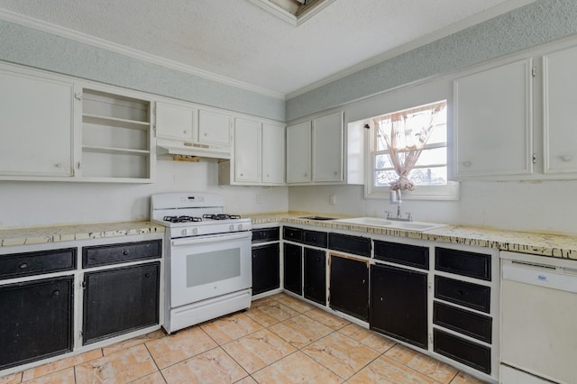 kitchen with white cabinetry, white appliances, and sink