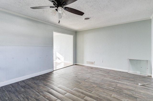 spare room featuring hardwood / wood-style floors, crown molding, a textured ceiling, and ceiling fan