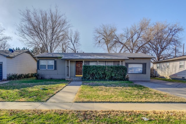 ranch-style house with a front yard