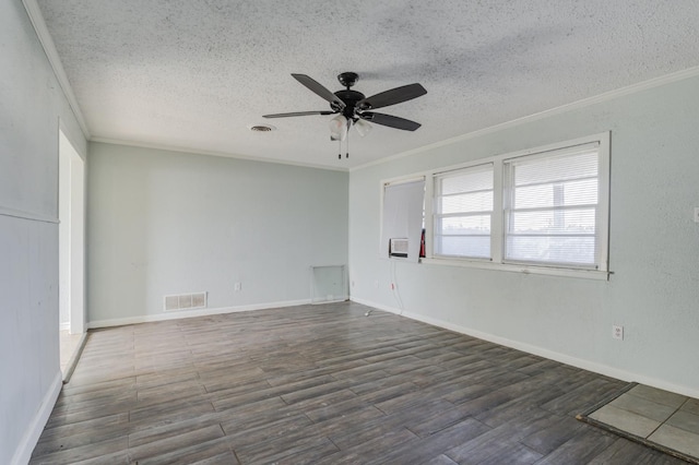 unfurnished room featuring dark wood-type flooring, ceiling fan, ornamental molding, and a textured ceiling