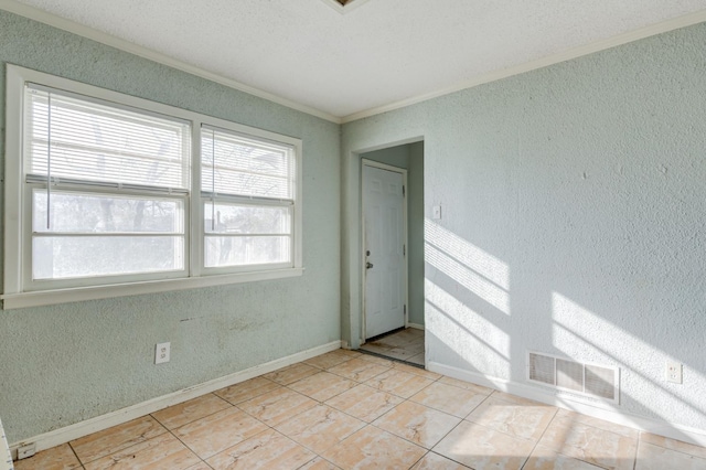 tiled spare room with crown molding