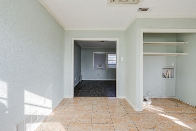 corridor with light tile patterned floors and ornamental molding