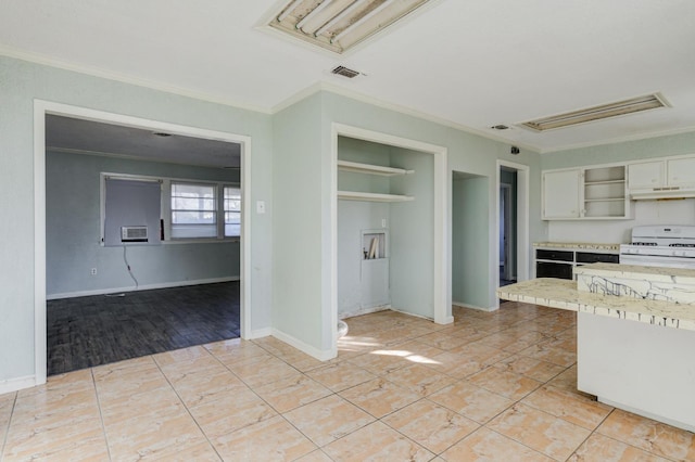 kitchen with white cabinetry, ornamental molding, white gas stove, and light tile patterned floors