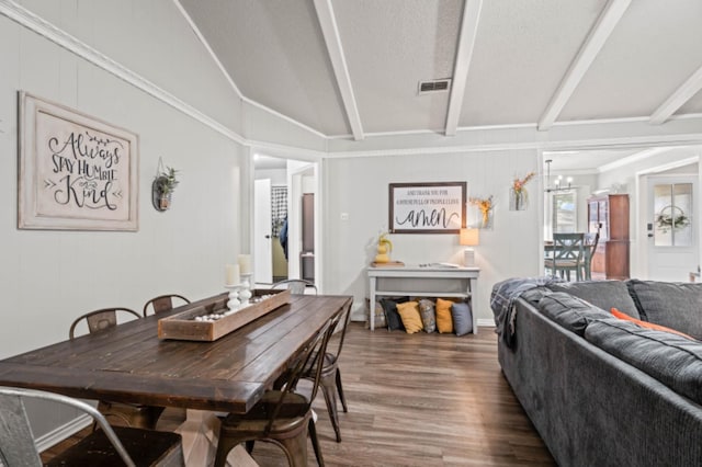 dining space featuring dark hardwood / wood-style flooring, vaulted ceiling with beams, and a textured ceiling