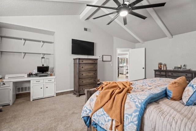 carpeted bedroom with vaulted ceiling with beams, built in desk, and ceiling fan