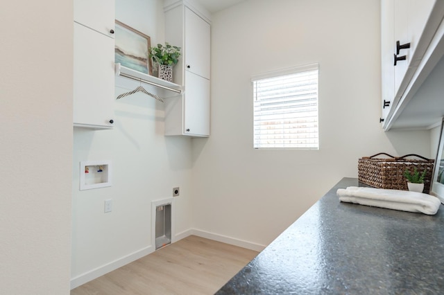 laundry room featuring cabinets, washer hookup, light wood-type flooring, and electric dryer hookup