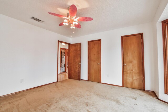 washroom featuring cabinets, hookup for a washing machine, a textured ceiling, and electric dryer hookup