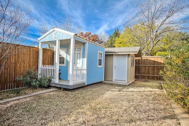 view of outbuilding featuring a yard