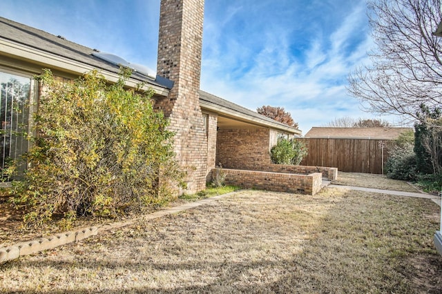 single story home featuring a garage and a front lawn