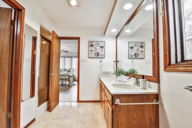 kitchen featuring a center island, a brick fireplace, kitchen peninsula, decorative backsplash, and black appliances