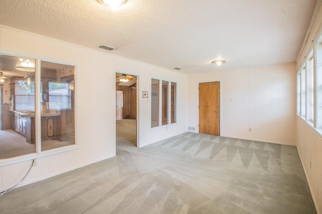 5720 71st St, Lubbock, TX 79424 - carpeted empty room featuring a textured ceiling and a ceiling fan