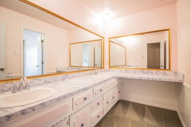 5720 71st St, Lubbock, TX 79424 - full bath featuring double vanity and a textured ceiling