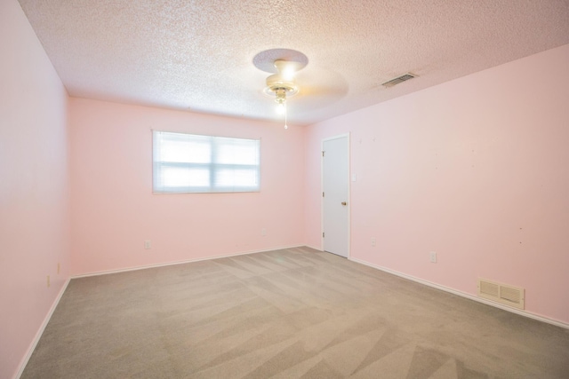 5720 71st St, Lubbock, TX 79424 - spare room with carpet flooring, ceiling fan, and a textured ceiling