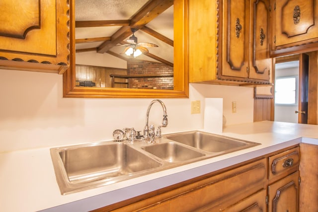 5720 71st St, Lubbock, TX 79424 - kitchen with light countertops, brown cabinets, and ceiling fan