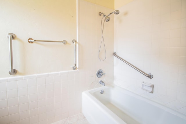 5720 71st St, Lubbock, TX 79424 - bathroom featuring shower / tub combination and tile walls