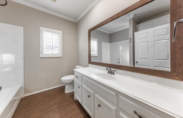 full bath featuring toilet, wood finished floors, vanity, baseboards, and ornamental molding