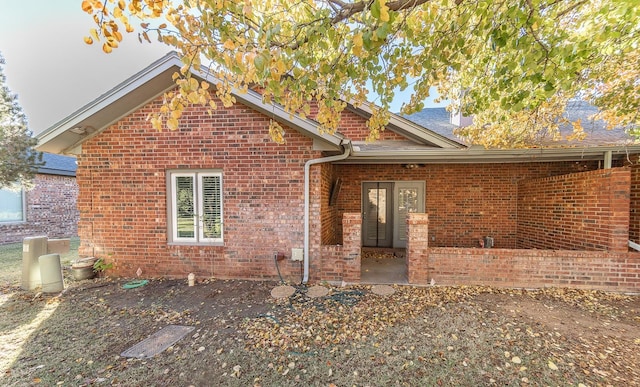 view of front of property featuring brick siding