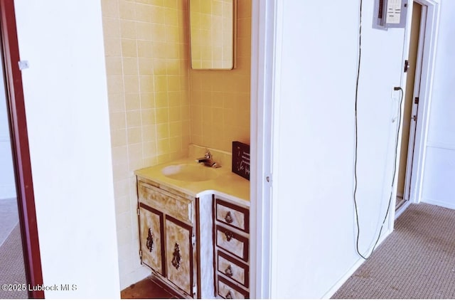 7907 Knoxville Ave, Lubbock, TX 79423 - bathroom with vanity and tile walls