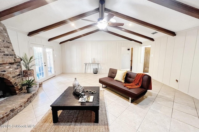 7907 Knoxville Ave, Lubbock, TX 79423 - living room with light tile patterned floors, a decorative wall, ceiling fan, and french doors