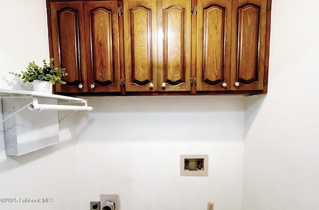 7907 Knoxville Ave, Lubbock, TX 79423 - washroom with washer hookup, cabinet space, and hookup for an electric dryer