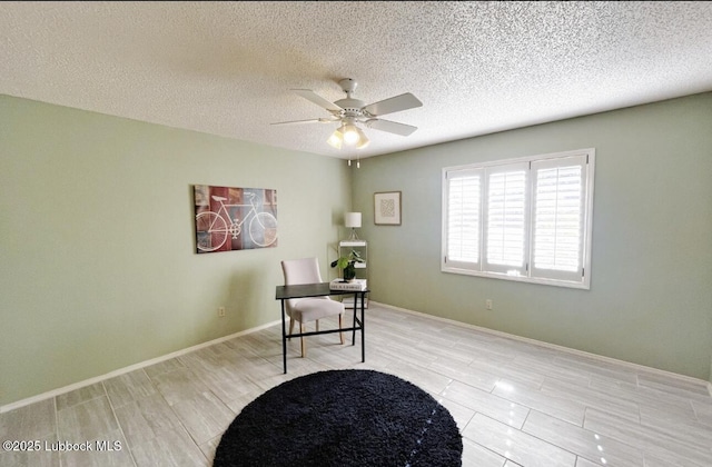 7907 Knoxville Ave, Lubbock, TX 79423 - office space featuring a ceiling fan, a textured ceiling, and baseboards