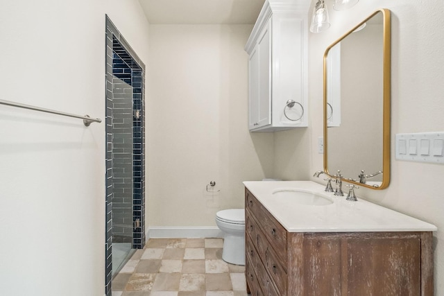 bathroom featuring vanity, toilet, and a shower