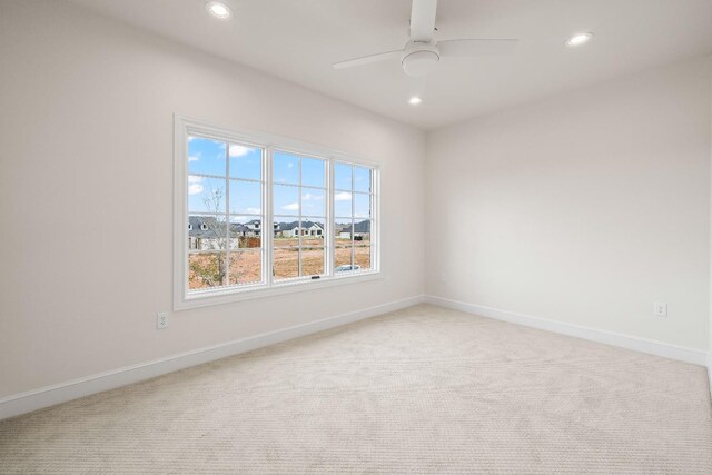 empty room with light carpet and ceiling fan