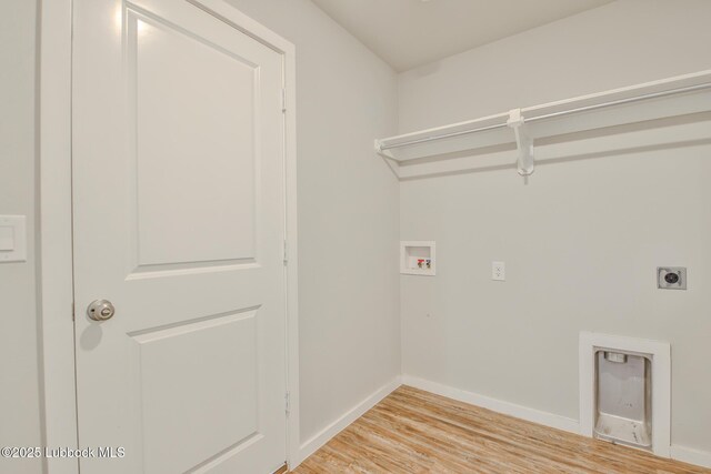 2012 Kenwood Ave, Lubbock, TX 79407 - laundry room featuring electric dryer hookup, hookup for a washing machine, and light wood-type flooring