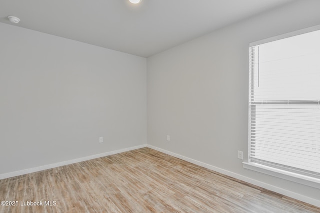 2012 Kenwood Ave, Lubbock, TX 79407 - unfurnished room featuring a smoke detector and light wood-style floors