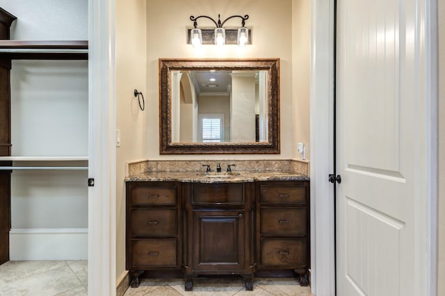 bathroom with vanity and tile patterned flooring