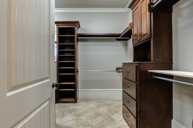 spacious closet featuring light tile patterned floors