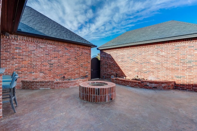 view of patio / terrace featuring an outdoor fire pit