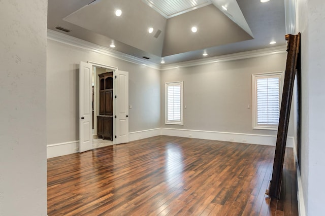 unfurnished room with crown molding, dark wood-type flooring, and vaulted ceiling