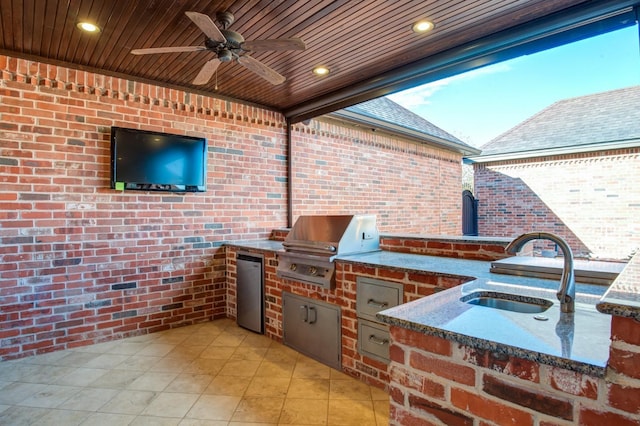 view of patio featuring an outdoor kitchen, sink, and grilling area