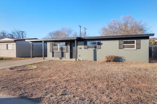 single story home featuring a carport