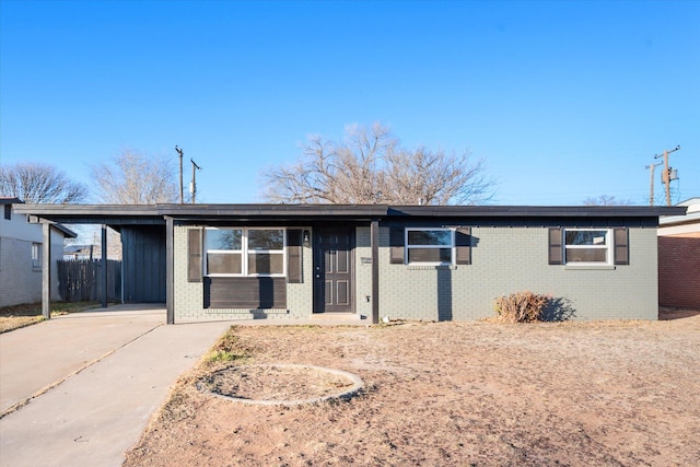 single story home featuring a carport