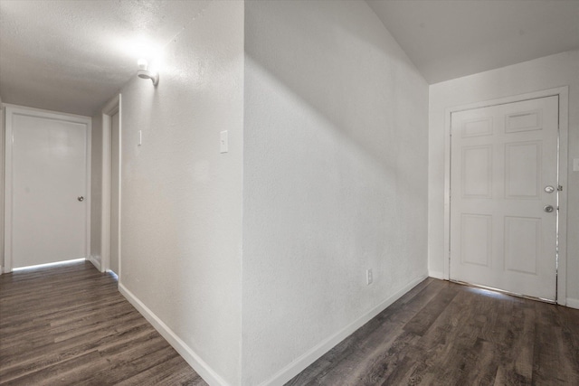 corridor with dark wood-type flooring